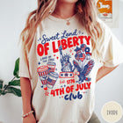 Comfort Colors tee in Ivory featuring 4th of July celebration graphic with Statue of Liberty and eagle