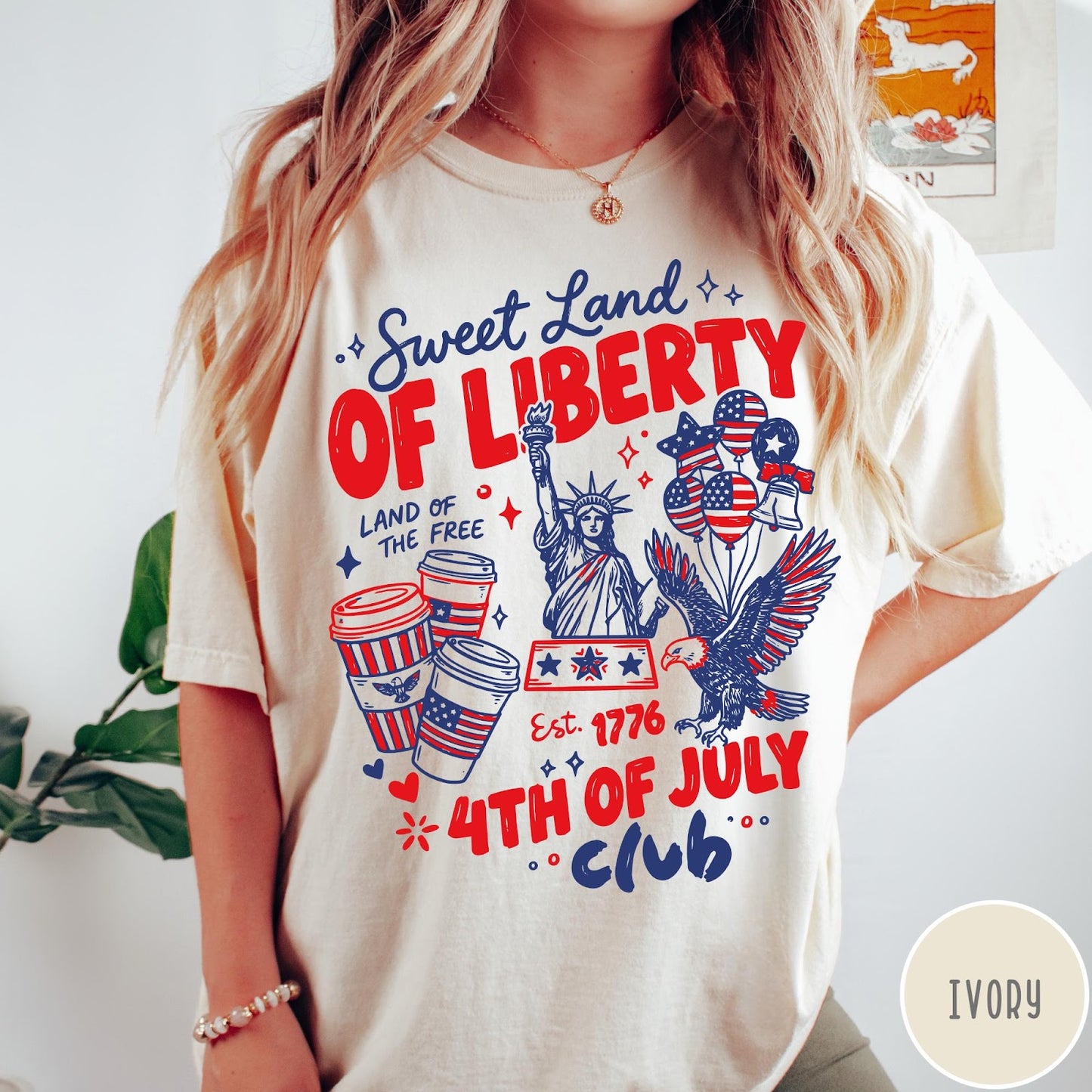 Comfort Colors tee in Ivory featuring 4th of July celebration graphic with Statue of Liberty and eagle