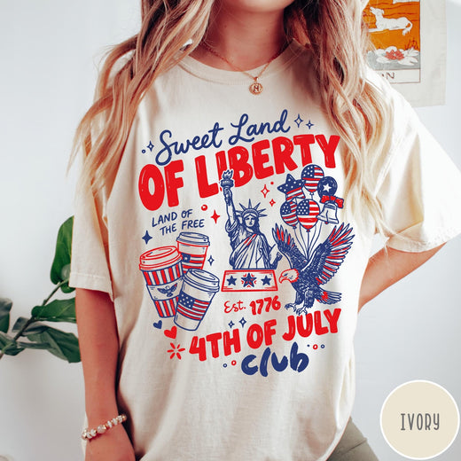 Comfort Colors tee in Ivory featuring 4th of July celebration graphic with Statue of Liberty and eagle