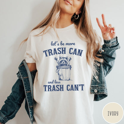 Comfort Colors tee in Ivory featuring casual graphic style with a raccoon inside a trash can illustration