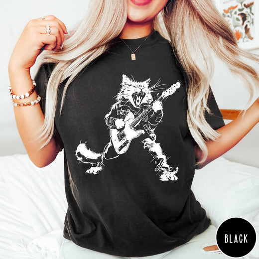 Comfort Colors tee in Black featuring rock music style graphic of a cat playing an electric guitar