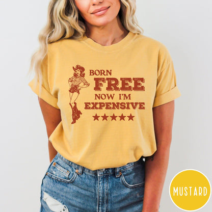 Comfort Colors tee in Mustard featuring cowgirl design with Born Free Now I'm Expensive text and stars