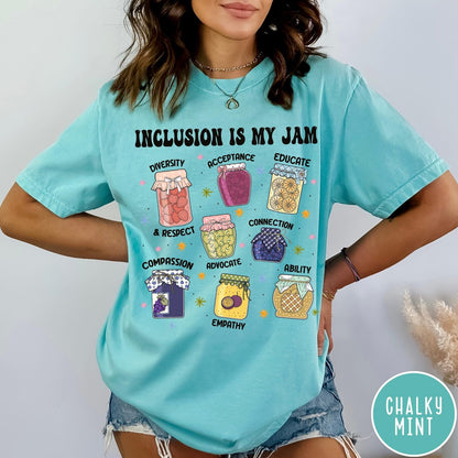 Comfort Colors tee in Chalky Mint featuring retro style graphic with jam jars labeled with inclusion and advocacy terms
