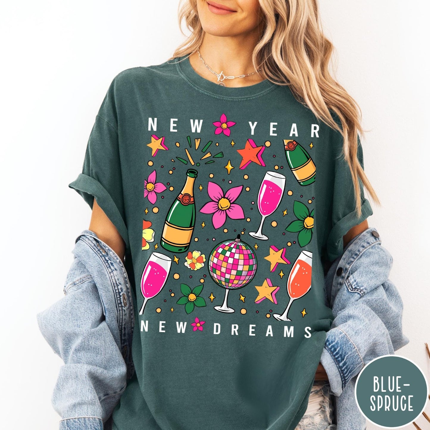 Comfort Colors tee in Blue Spruce featuring New Year celebration graphic with champagne bottles, glasses, and disco ball