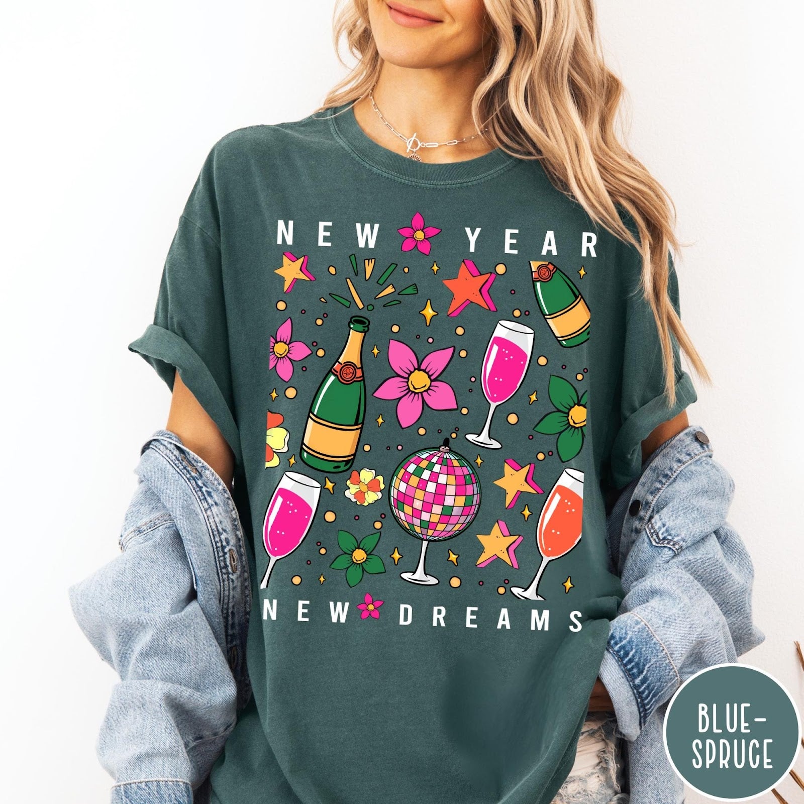 Comfort Colors tee in Blue Spruce featuring New Year celebration graphic with champagne bottles, glasses, and disco ball