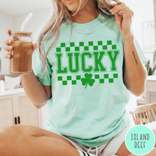 Comfort Colors tee in Island Reef featuring checkerboard design with Lucky text and a shamrock graphic