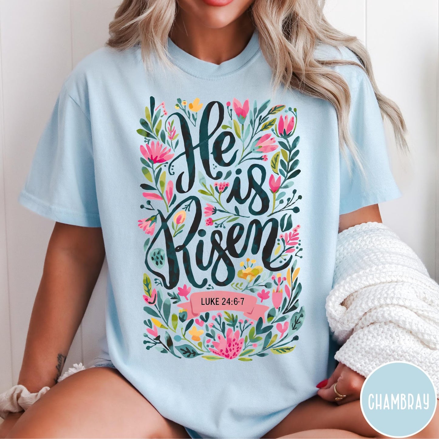 Comfort Colors tee in Chambray featuring Easter religious floral graphic with He is Risen and Luke 24:6-7 text