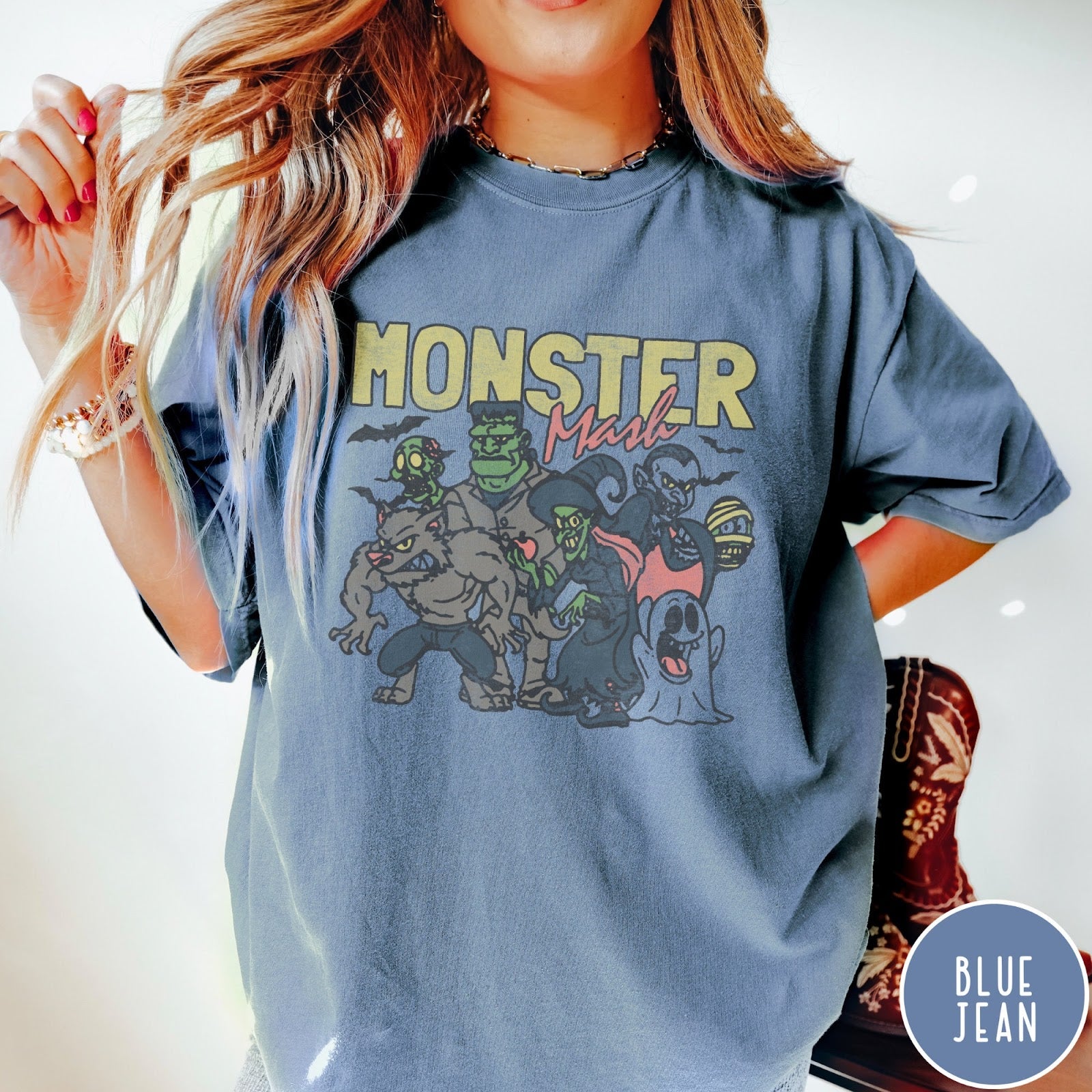 Comfort Colors tee in Blue Jean featuring retro Halloween style graphic with various classic monsters and spooky characters