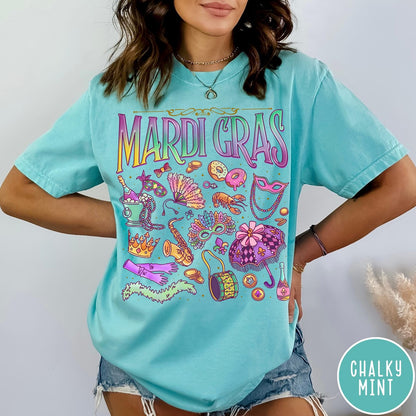 Comfort Colors tee in Chalky Mint featuring vintage style Mardi Gras celebration icons including masks, beads, and saxophone