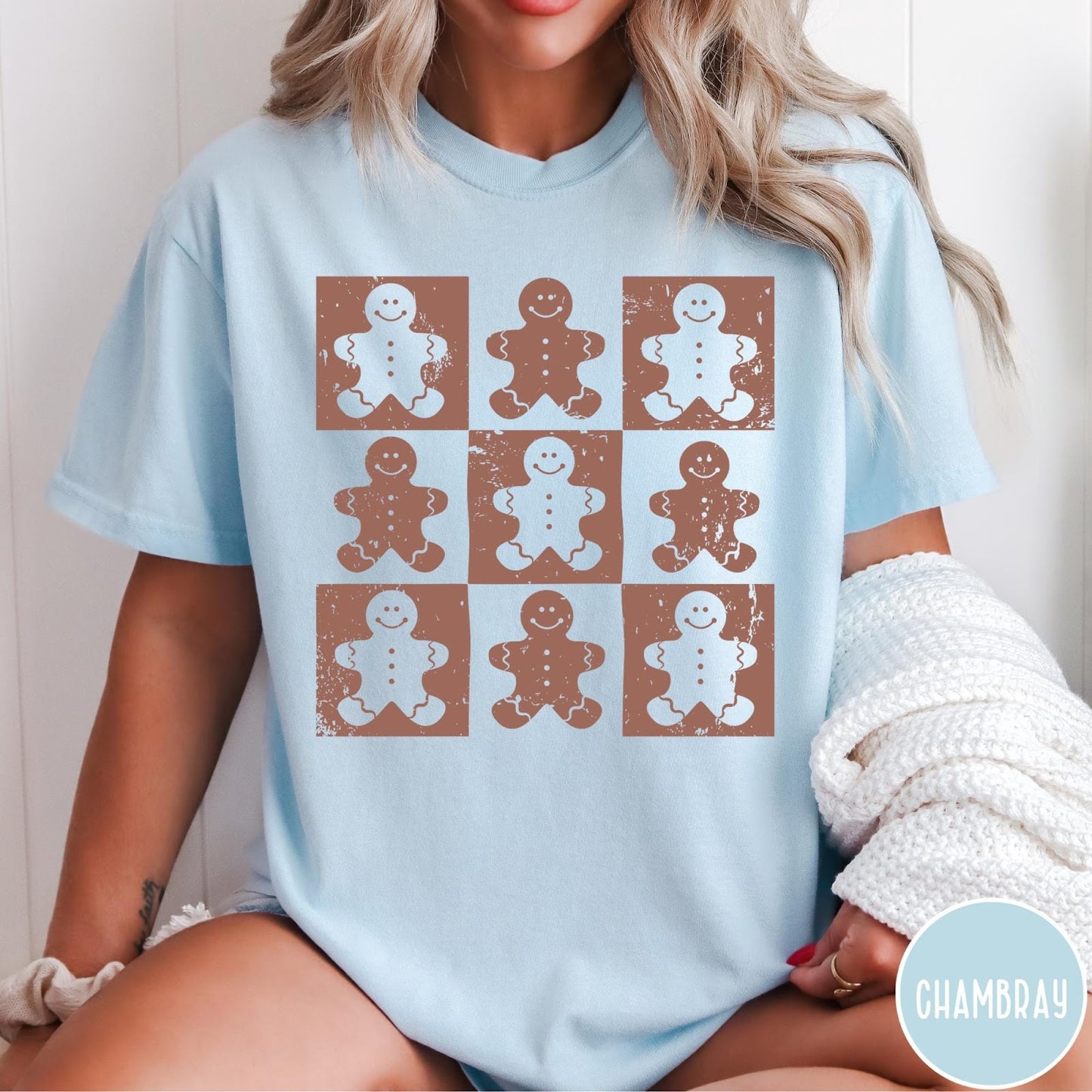 Comfort Colors tee in Chambray featuring distressed grid design with white gingerbread cookie silhouettes in each square