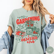 Comfort Colors tee in Bay featuring retro graphic gardening design with tomato plant, seeds, and gardening tools