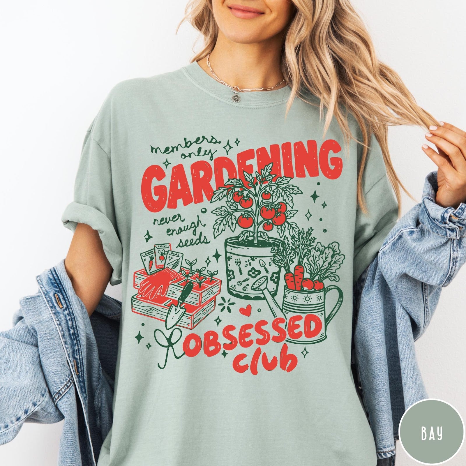 Comfort Colors tee in Bay featuring retro graphic gardening design with tomato plant, seeds, and gardening tools