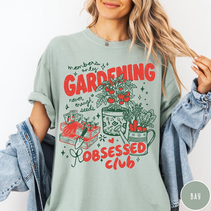 Comfort Colors tee in Bay featuring retro graphic gardening design with tomato plant, seeds, and gardening tools
