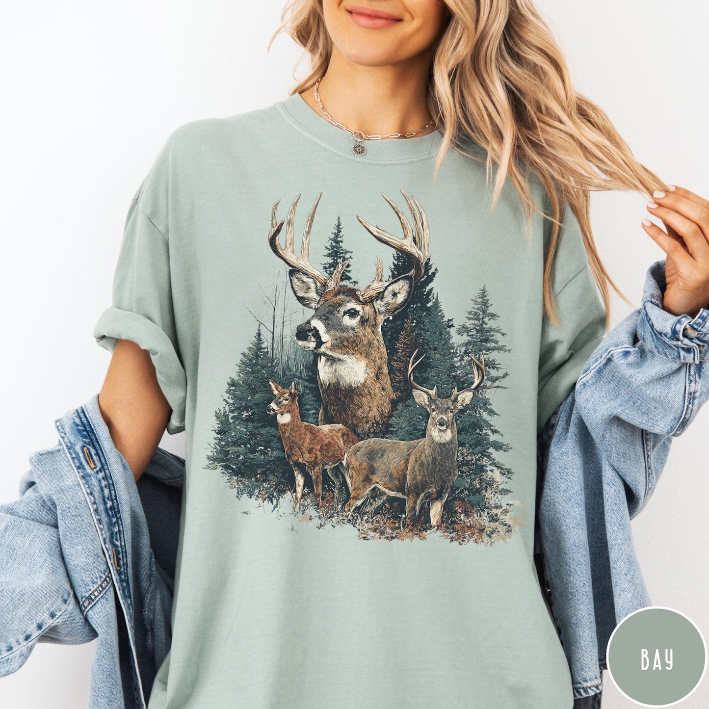 Comfort Colors tee in Bay featuring vintage style graphic of a deer family in a forest scene