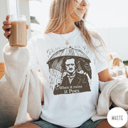Comfort Colors tee in White featuring graphic illustration of Edgar Allan Poe with umbrella and raven