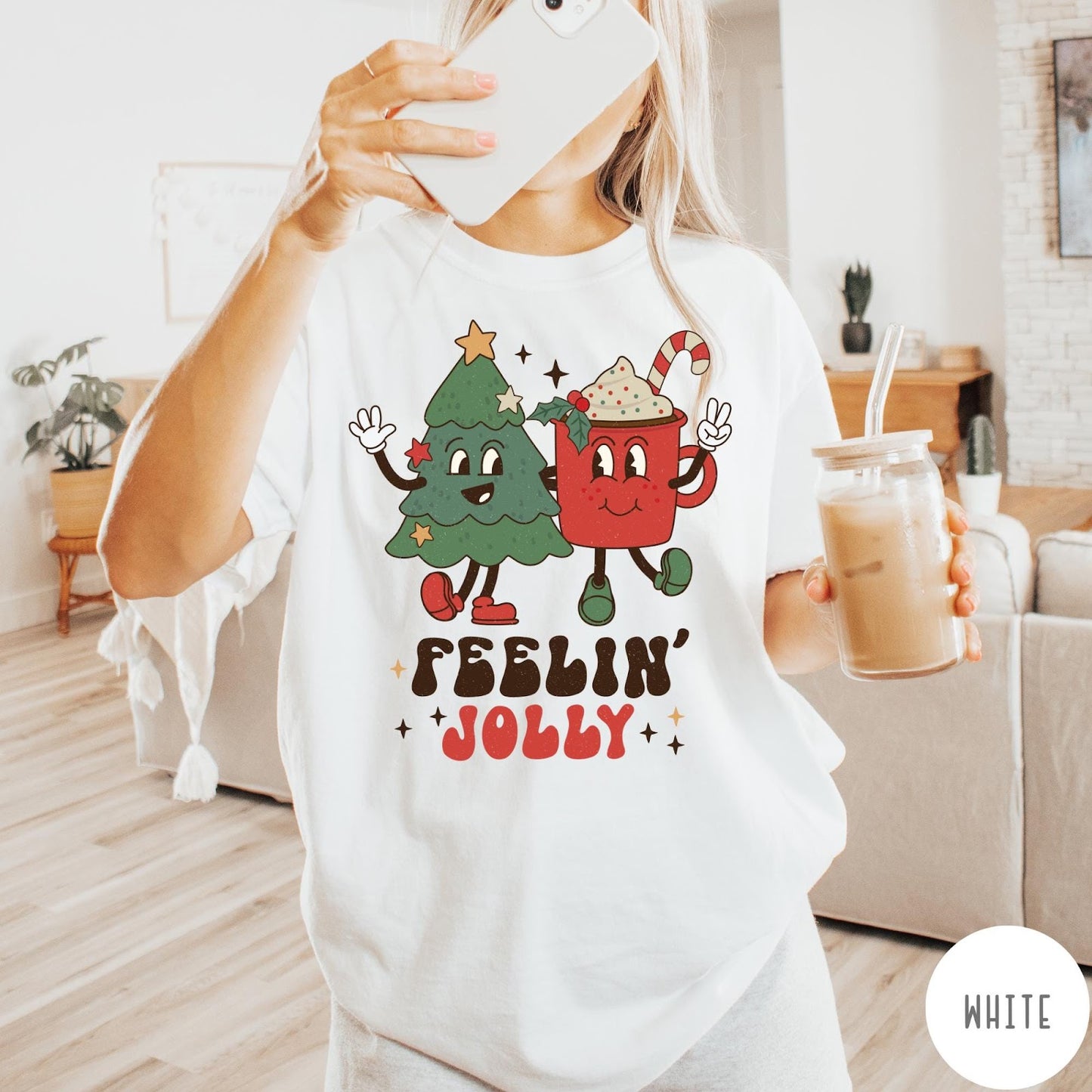 Comfort Colors tee in White featuring retro style graphic of a cartoon Christmas tree and cocoa mug