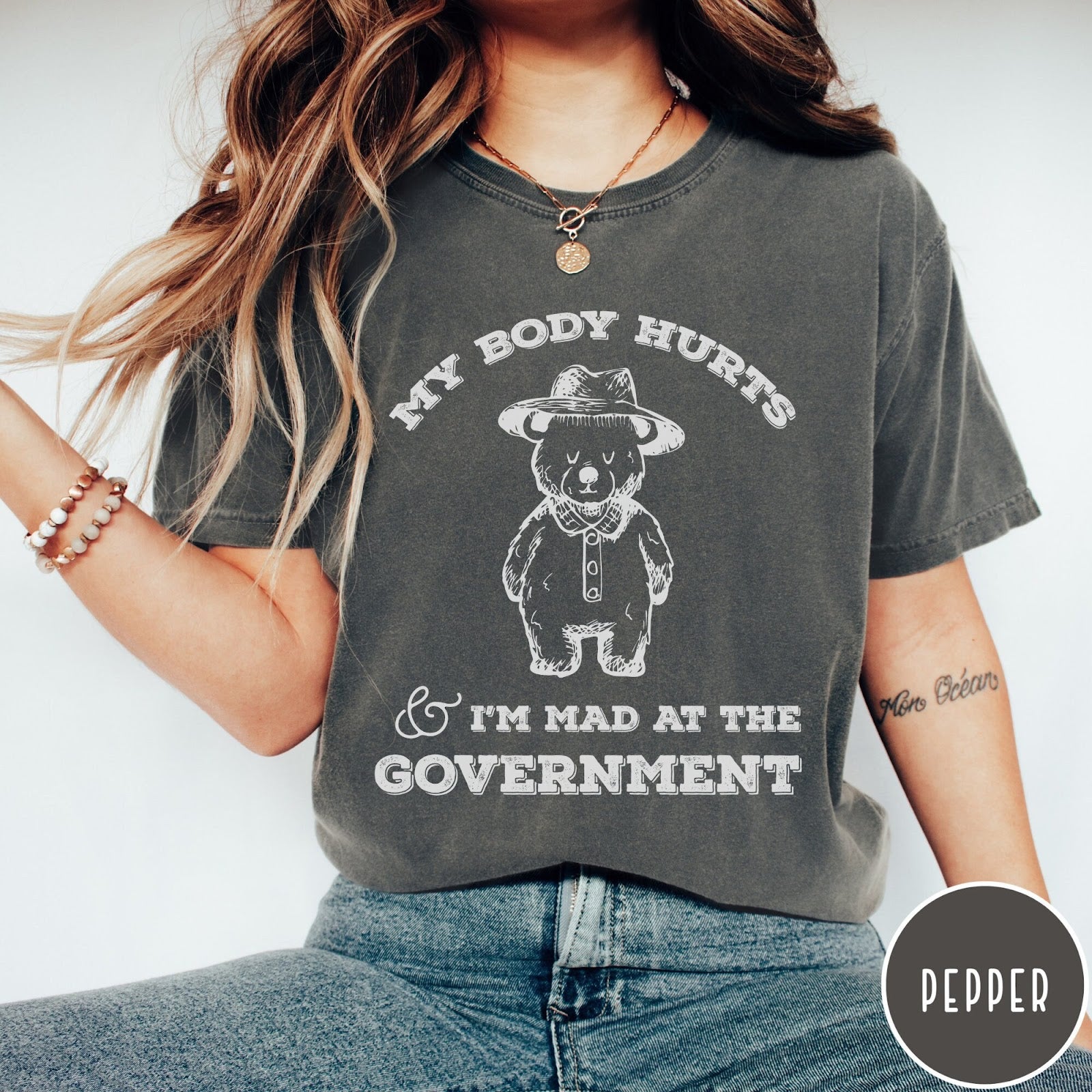 Comfort Colors tee in Pepper featuring line art style bear wearing a hat and button-up shirt graphic