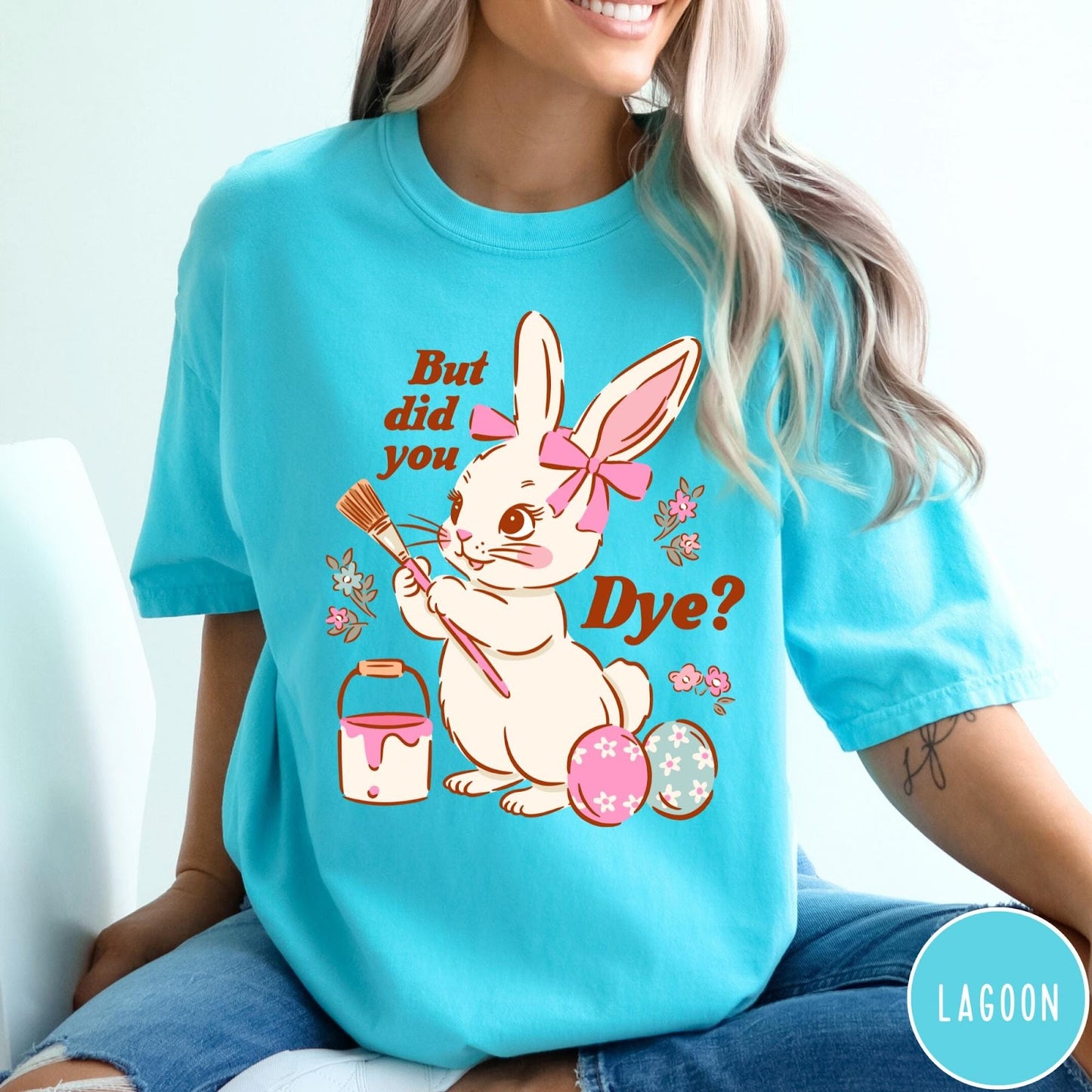 Comfort Colors tee in Lagoon featuring Easter bunny design with paintbrush, paint bucket, and decorated Easter eggs