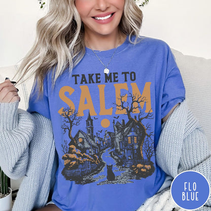 Comfort Colors tee in Flo Blue featuring vintage style Salem town scene with black cat and pumpkins