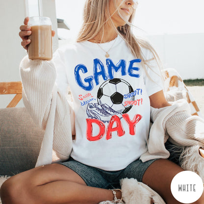 Comfort Colors tee in White featuring soccer graphic with a ball, cleats, and Game Day text