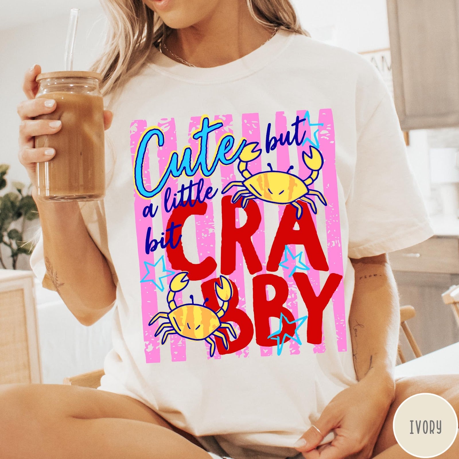 Comfort Colors tee in Ivory featuring graphic design with crabs and text reading Cute but a little bit Crabby