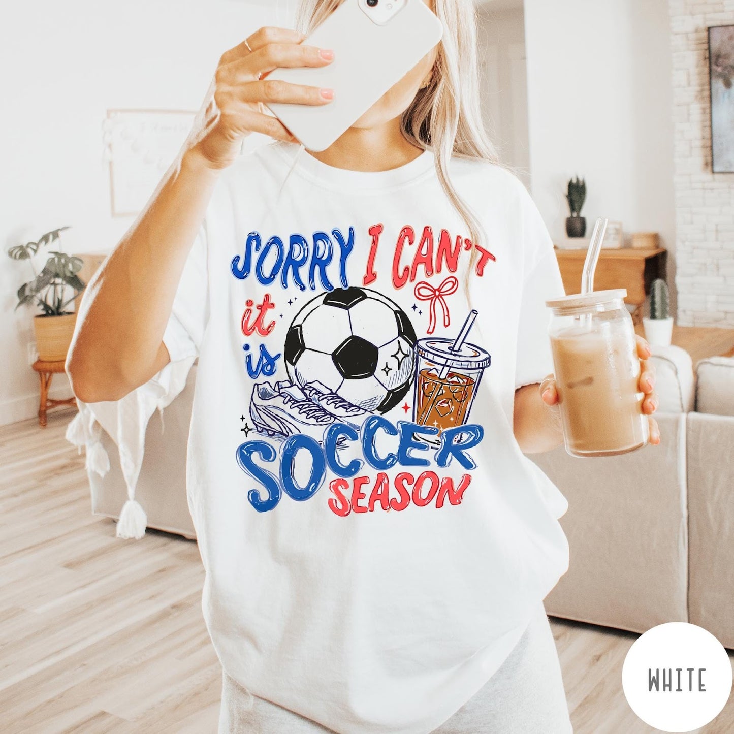 Comfort Colors tee in White featuring soccer season graphic with soccer ball, cleats, and iced coffee
