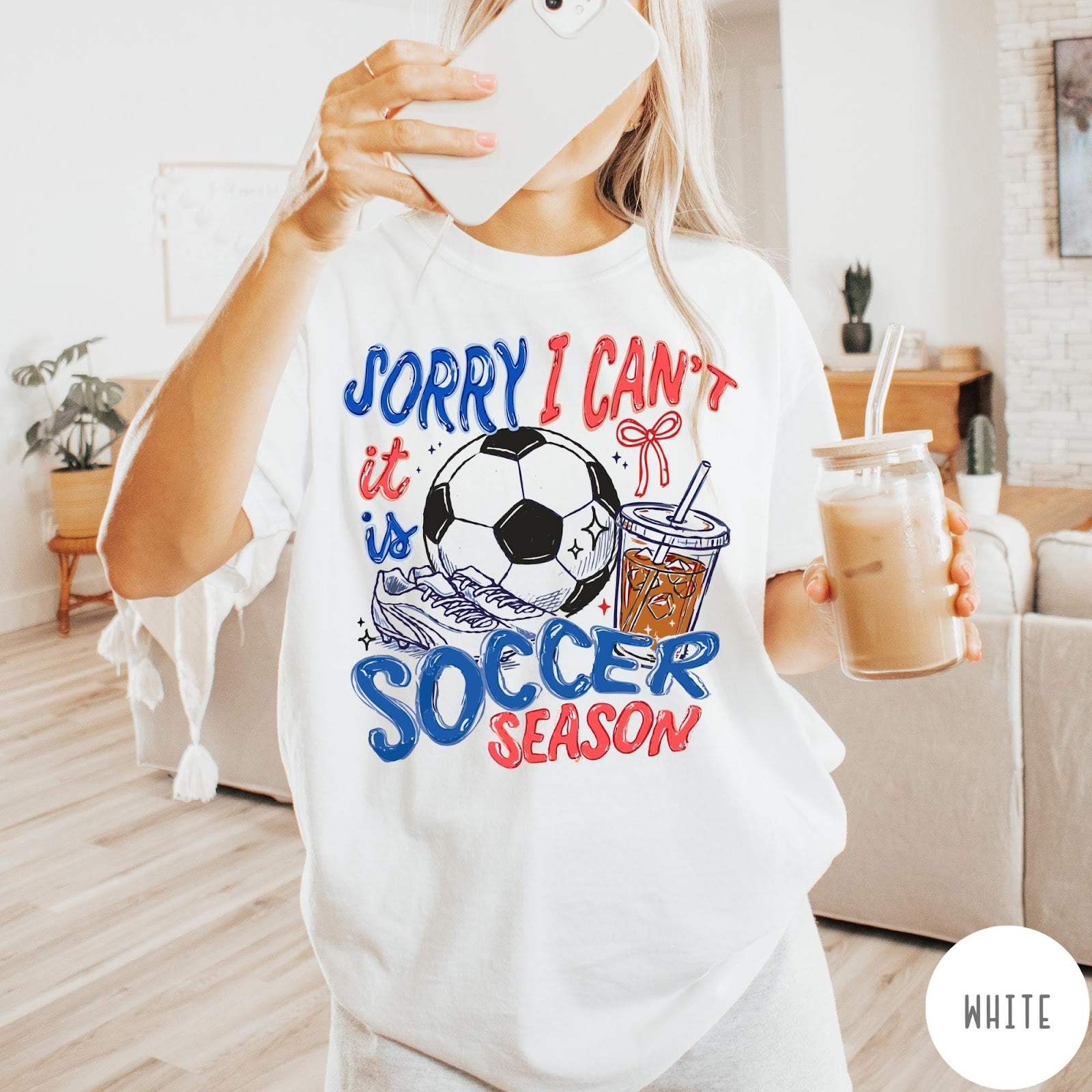 Comfort Colors tee in White featuring soccer season graphic with soccer ball, cleats, and iced coffee