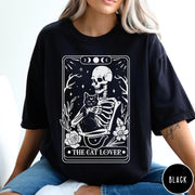 Comfort Colors tee in Black featuring tarot style graphic of a skeleton holding a black cat