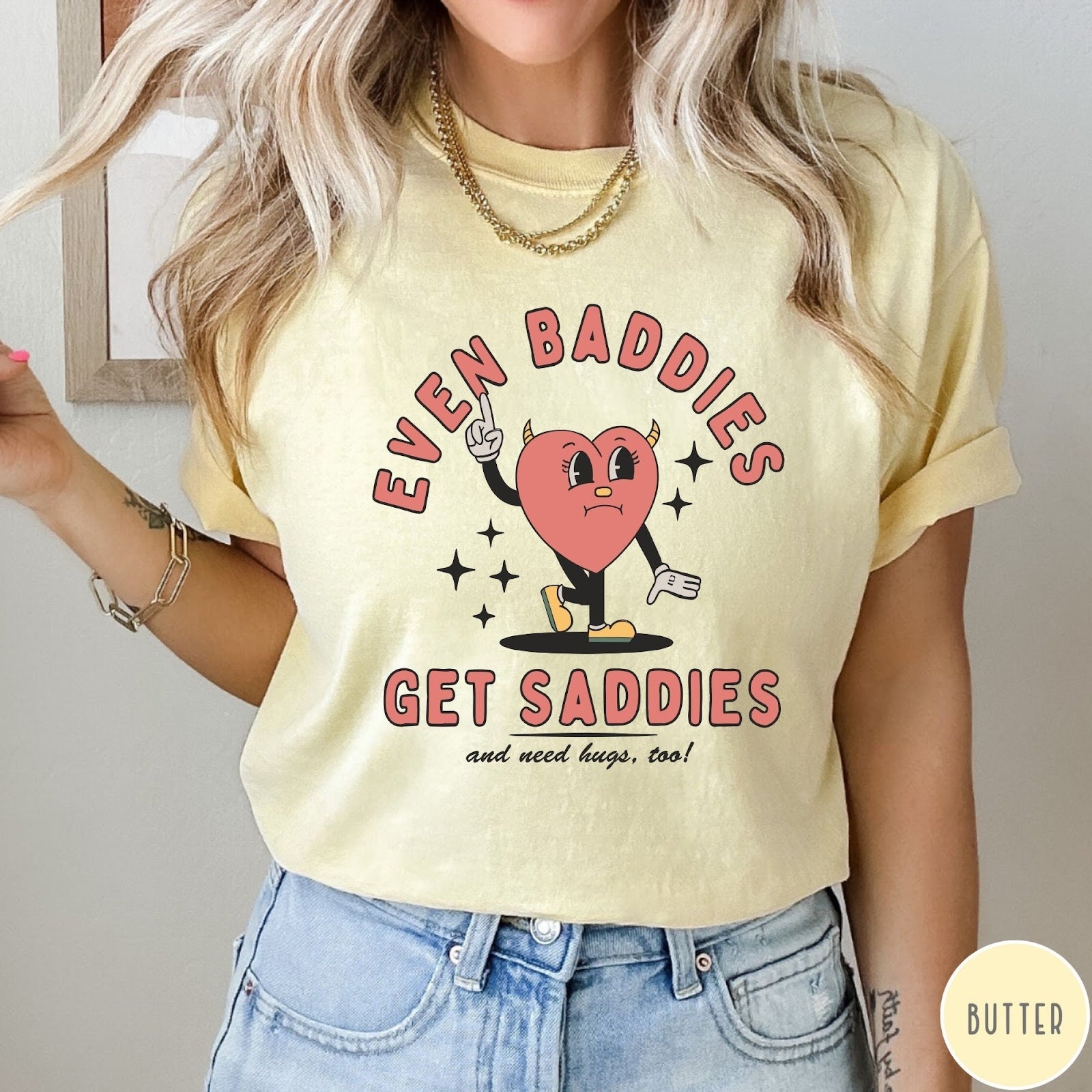 Comfort Colors tee in Butter featuring retro style graphic of a sad heart character with devil horns