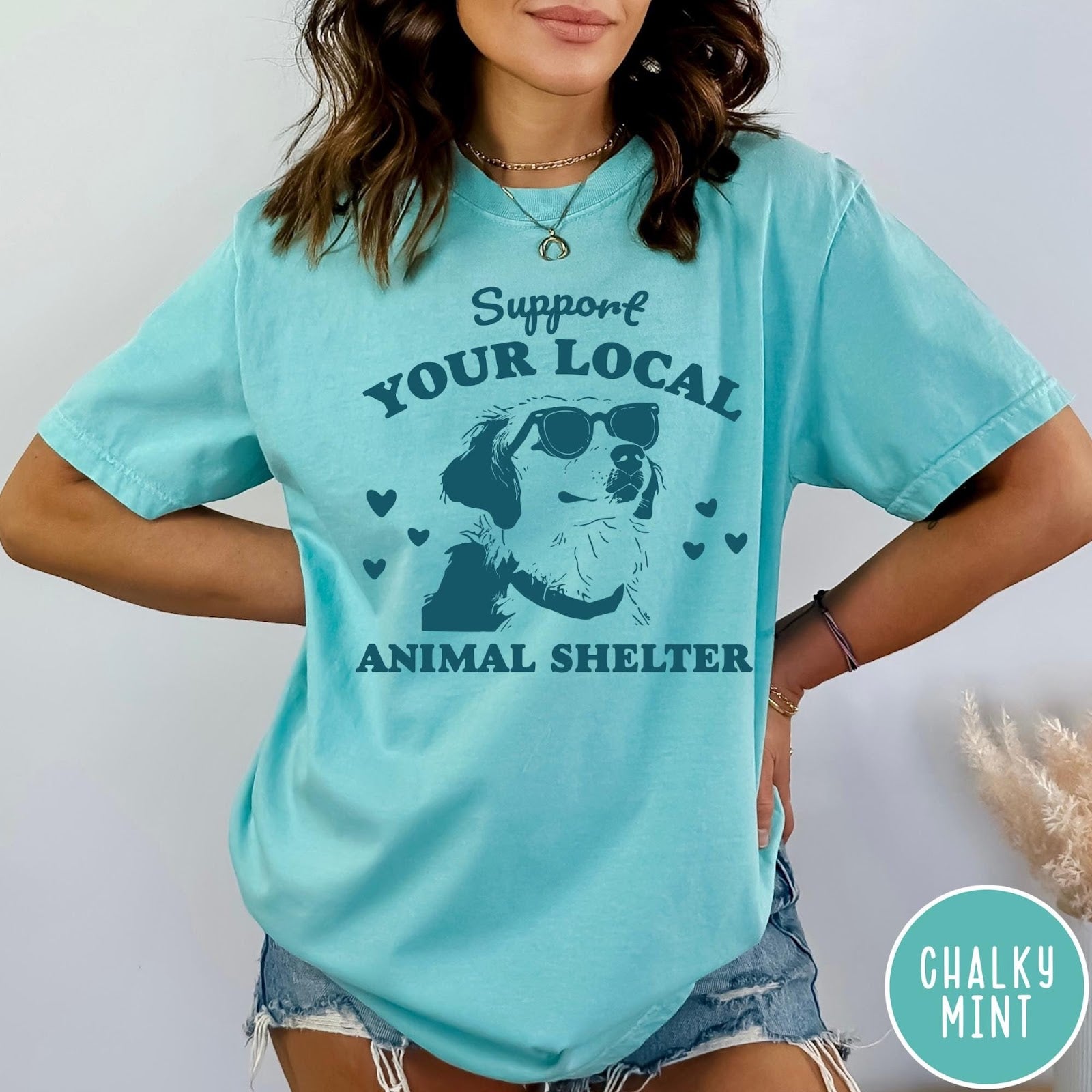 Comfort Colors tee in Chalky Mint featuring graphic illustration of a dog wearing sunglasses and surrounding small hearts