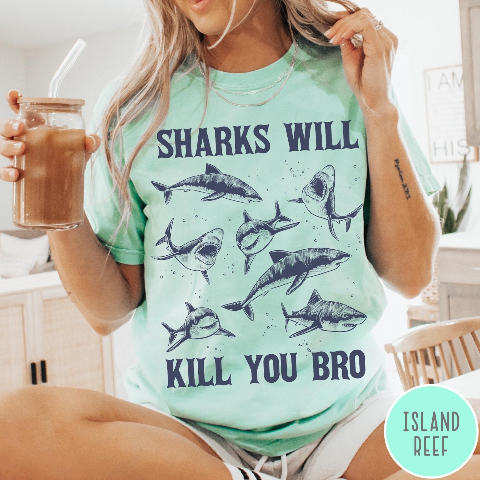 Comfort Colors tee in Island Reef featuring illustrative style graphic of multiple sharks and text Sharks Will Kill You