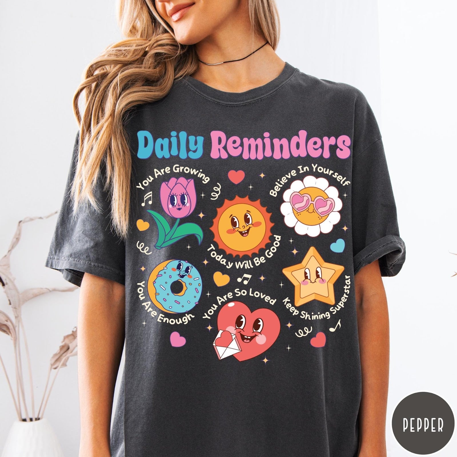 Comfort Colors tee in Pepper featuring retro mascot graphic with daily affirmations and cute cartoon characters