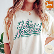 Comfort Colors tee in Ivory featuring retro Christmas style Feliz Navidad greeting with stars and holiday text