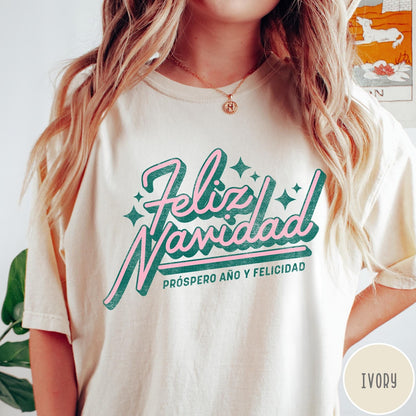 Comfort Colors tee in Ivory featuring retro Christmas style Feliz Navidad greeting with stars and holiday text