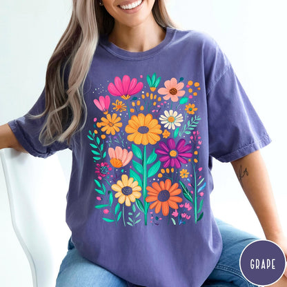 Comfort Colors tee in Grape featuring boho style floral graphic with vibrant orange, pink, and purple flowers
