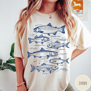 Comfort Colors tee in Pepper featuring vintage line illustration of various fish species with their names labeled.