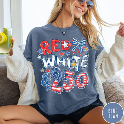 Comfort Colors tee in Blue Jean featuring patriotic 250th anniversary graphic with red white and blue stars and bow