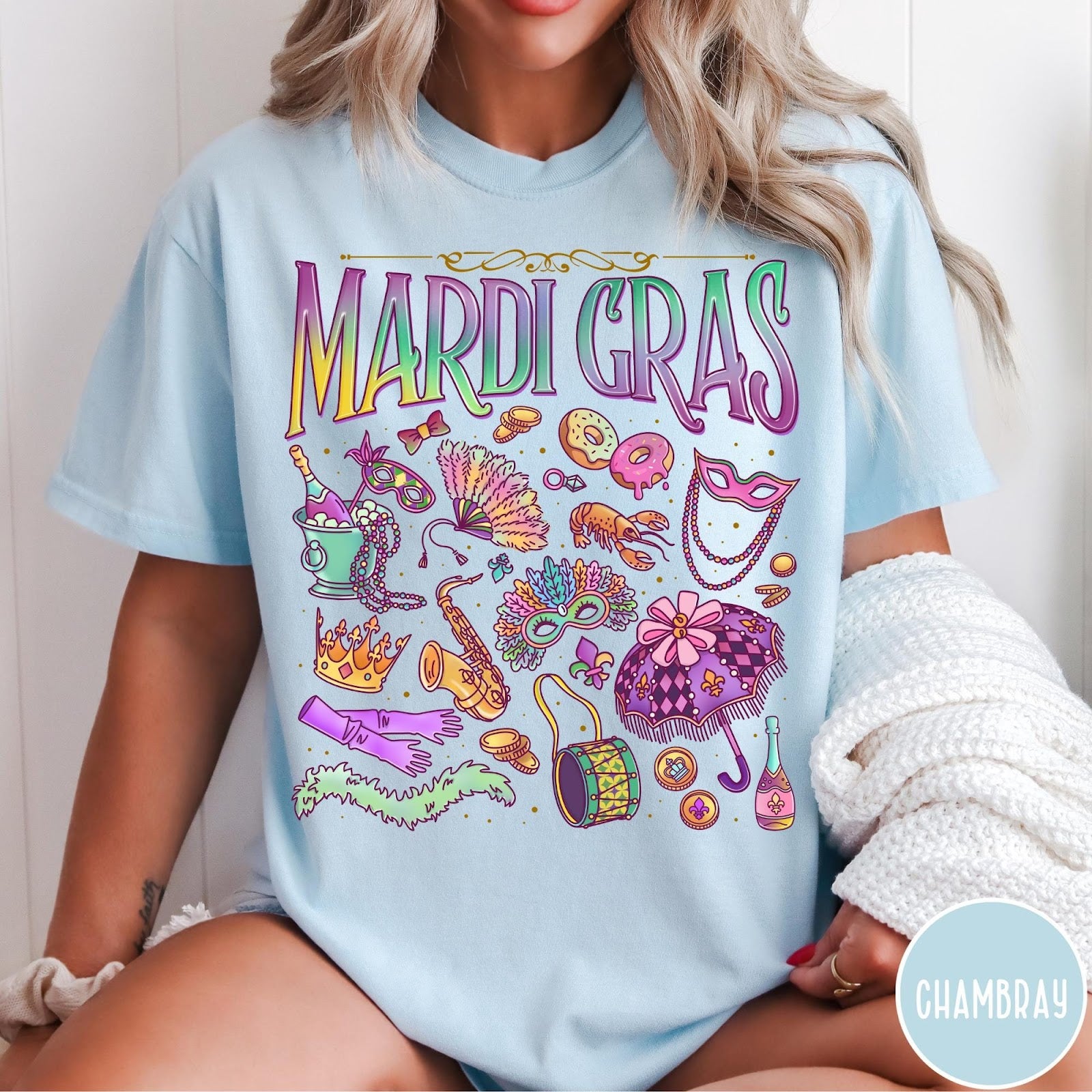 Comfort Colors tee in Chambray featuring vintage style Mardi Gras celebration icons including masks, beads, and saxophone