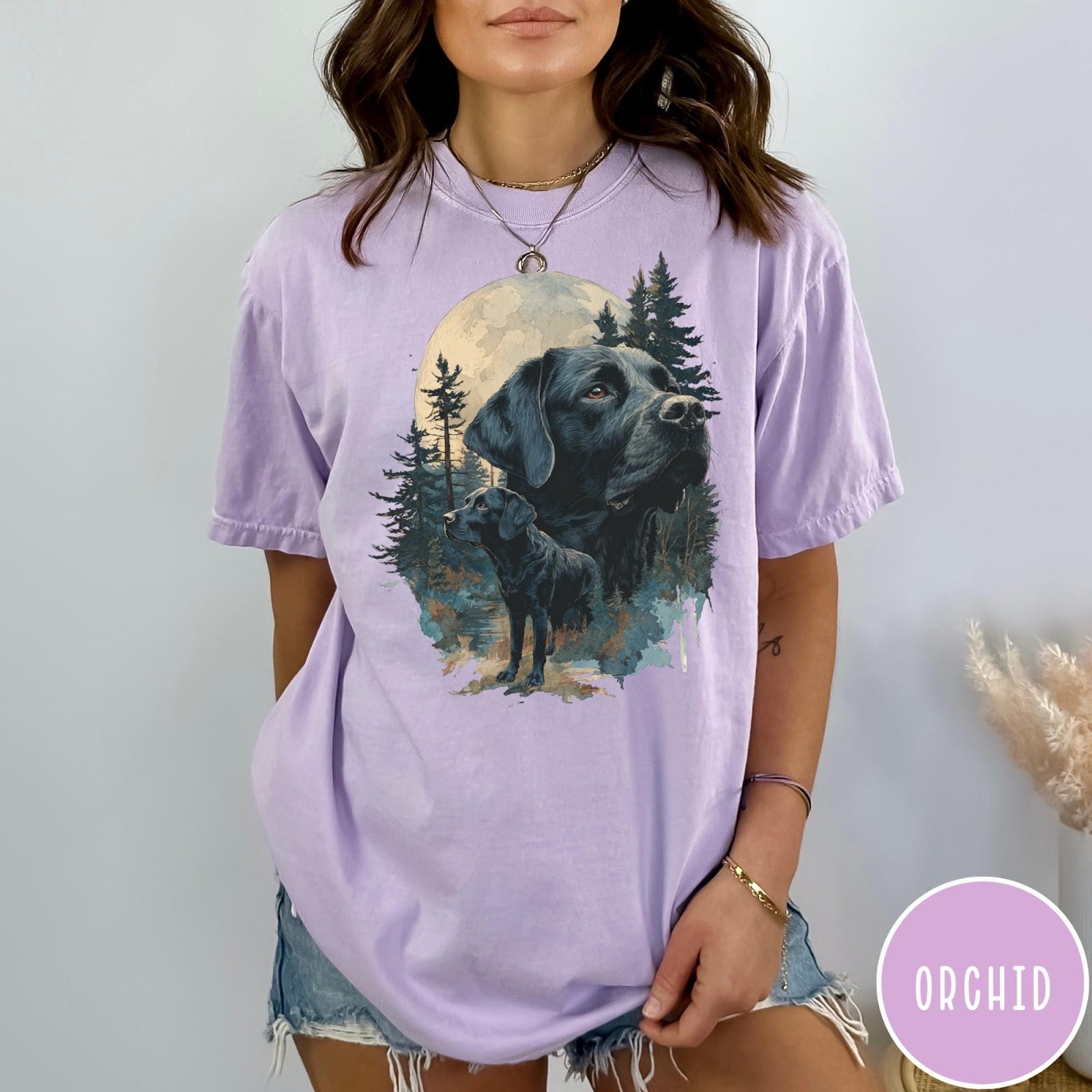 Comfort Colors tee in Orchid featuring artistic graphic of Black Labrador dogs in a forest moon setting