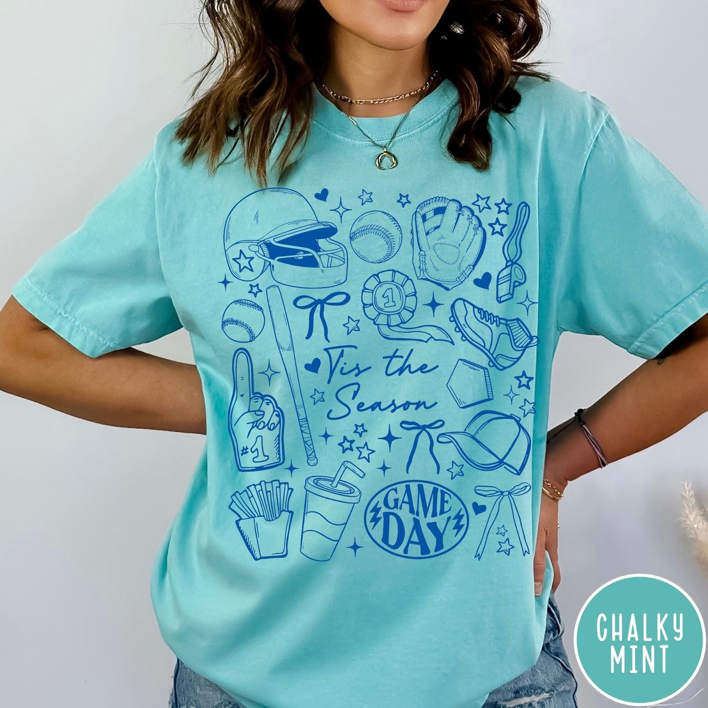 Comfort Colors tee in Chalky Mint featuring baseball game day graphic with helmet, bat, ball, and snacks.
