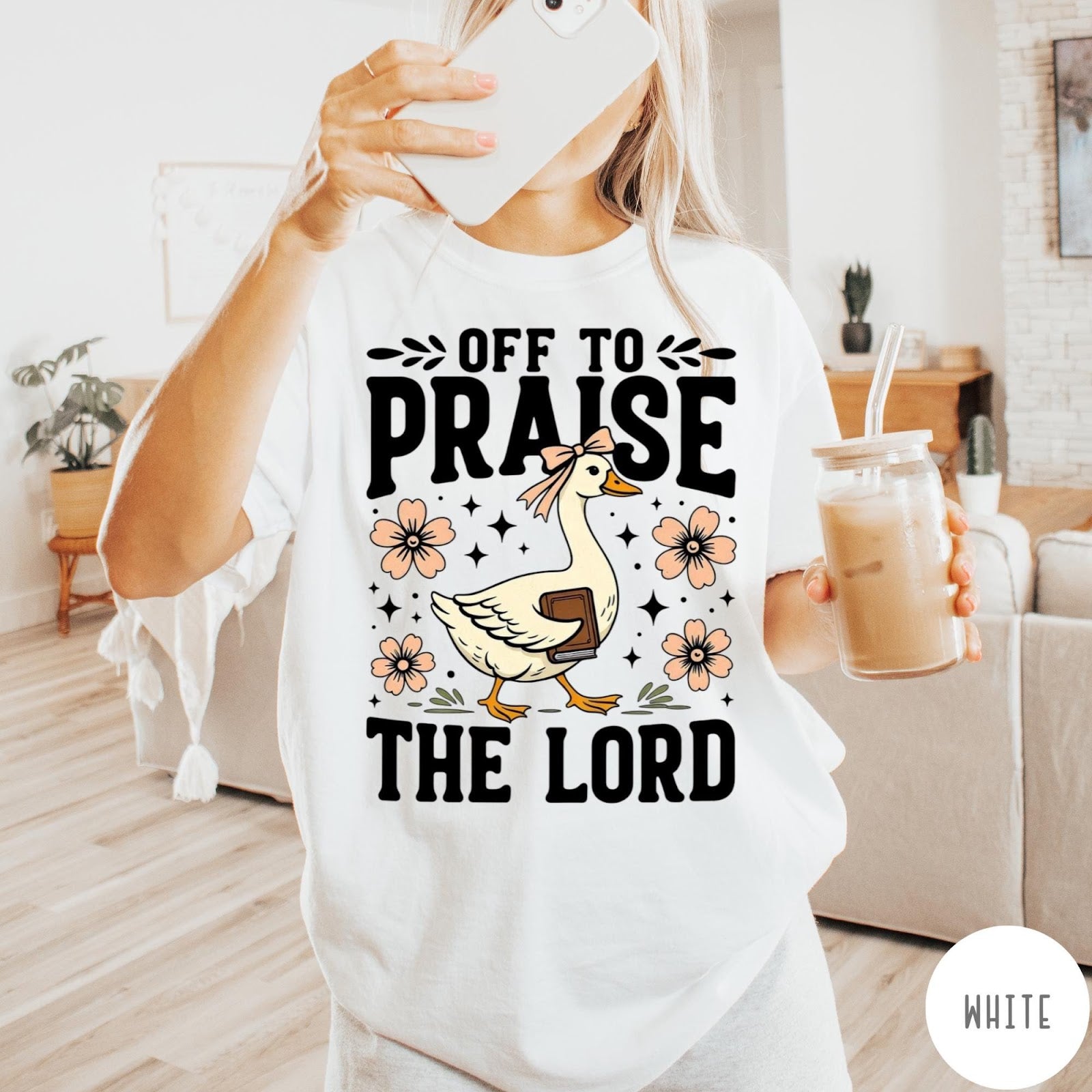 Comfort Colors tee in White featuring screen print style graphic of a goose carrying a book