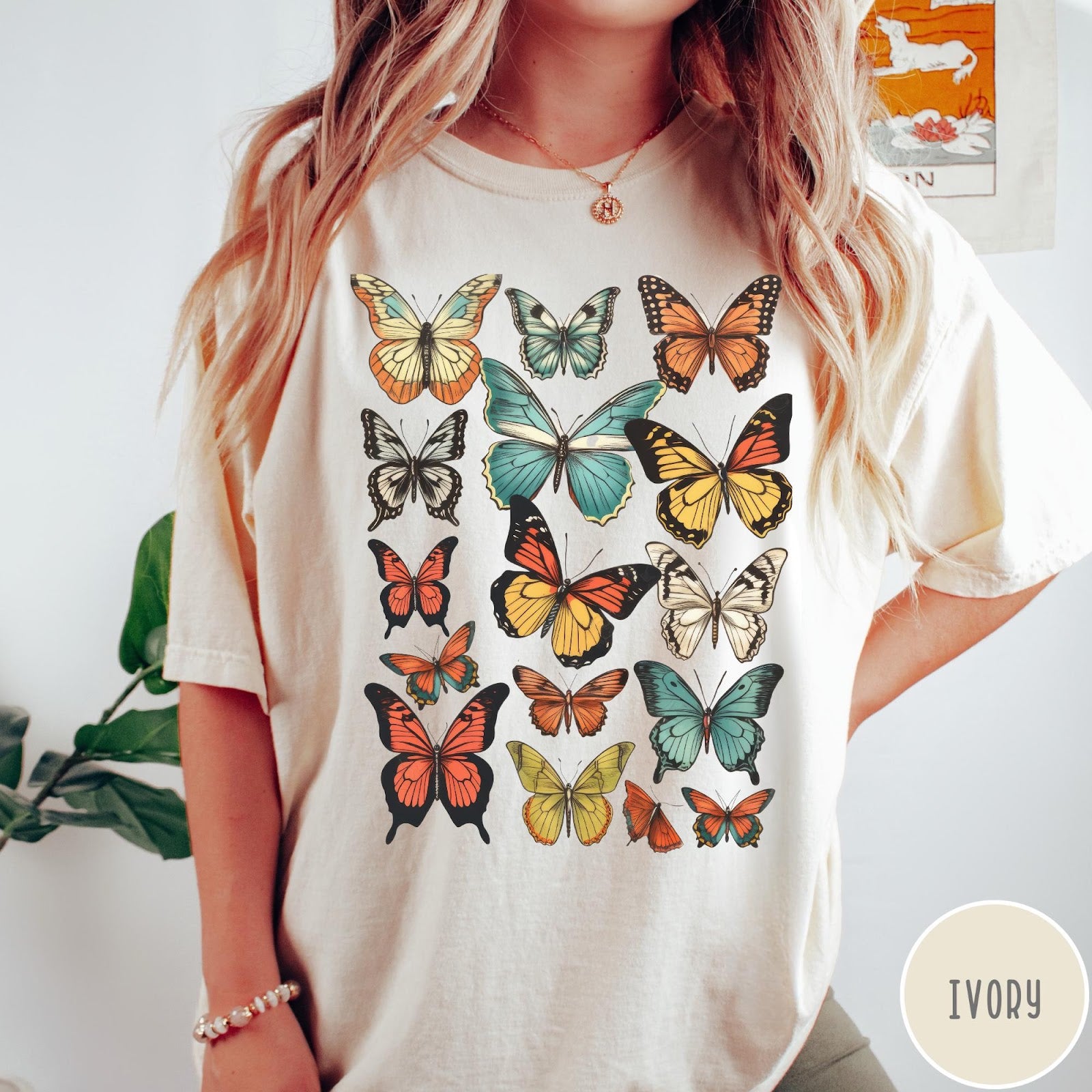 Comfort Colors tee in Ivory featuring butterfly collection design with various colorful butterfly illustrations in a grid