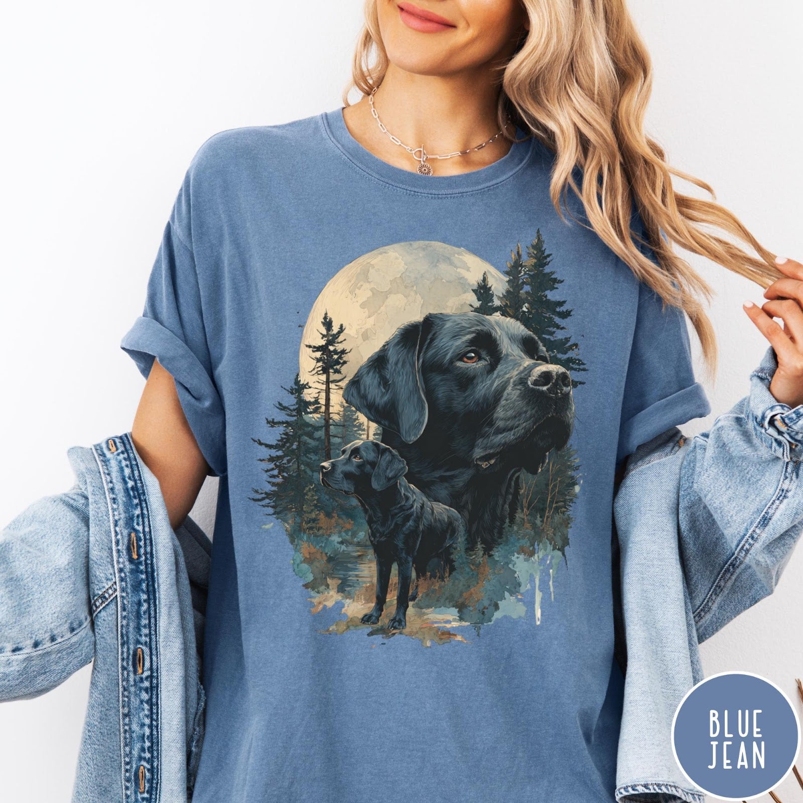 Comfort Colors tee in Blue Jean featuring nature style graphic of black Labrador dogs in a forest moon scene