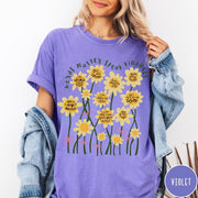 Comfort Colors tee in Violet featuring daisy graphic with positive affirmations and encouraging words about kindness