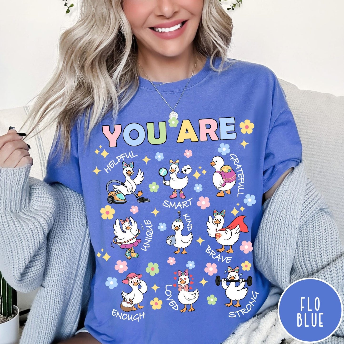 Comfort Colors tee in Flo Blue featuring cute cartoon duck graphic with inspirational words like kind and brave