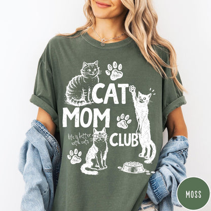 Comfort Colors tee in Moss featuring vintage style graphic with cats, paw prints, and Cat Mom Club text
