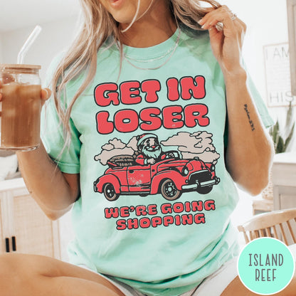 Comfort Colors tee in Island Reef featuring retro style graphic of Santa Claus driving a red convertible car