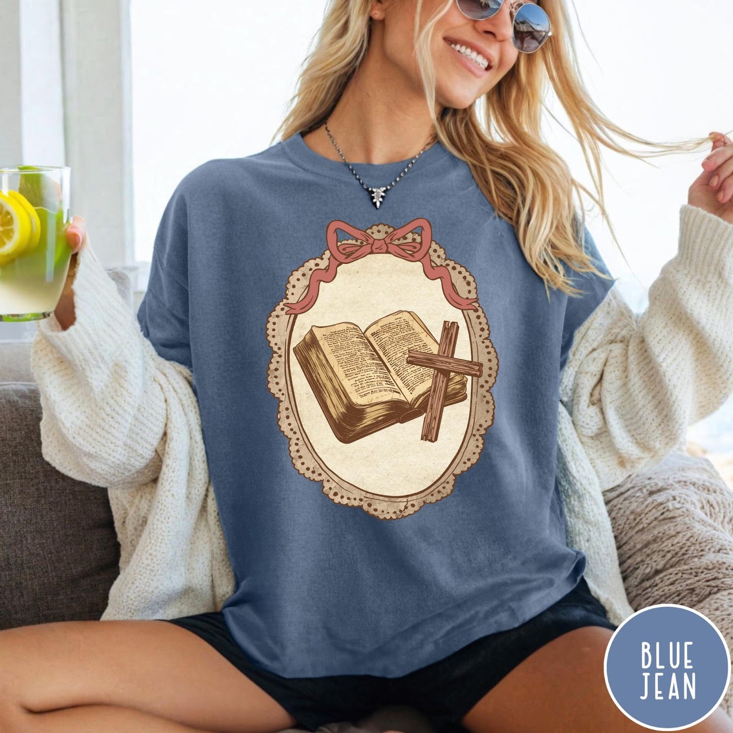 Comfort Colors tee in Blue Jean featuring vintage style graphic of an open Bible and wooden cross