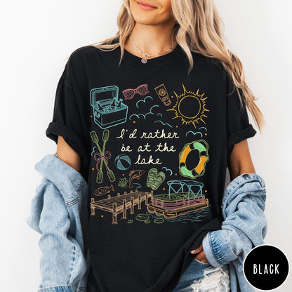Comfort Colors tee in Black featuring lake vacation graphic with pontoon boat, dock, and summer accessories