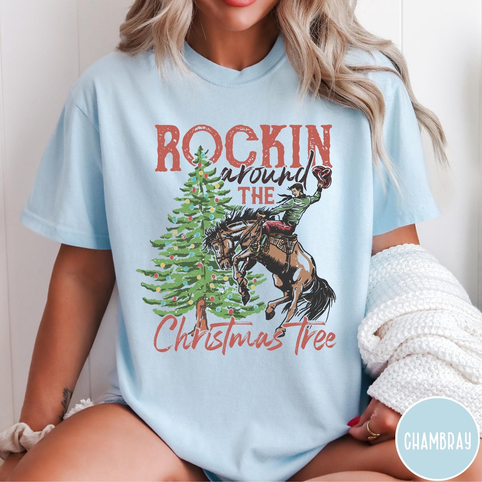 Comfort Colors tee in Chambray featuring western graphic design of a cowboy on a bucking horse Christmas tree